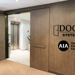 Using Integrated Fire Doors for Elevator Smoke Containment