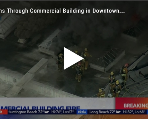 Fire burns through roof of building in Los Angeles